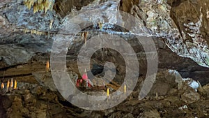 Under the ground. Beautiful view of stalactites and stalagmites in an underground cavern - New Athos Cave. Sacred