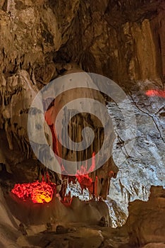 Under the ground. Beautiful view of stalactites and stalagmites in an underground cavern - New Athos Cave. Sacred