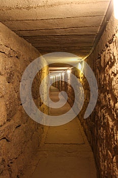 Under ground tunnel with light at the end of it