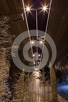 Under highway bridge at night