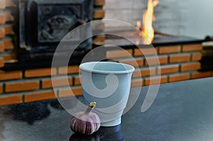 A pestle and garlic cup on the table for use photo