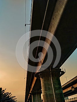 under the LRT bridge in the afternoon