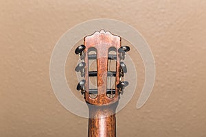 Under a nylon string guitar's headstock