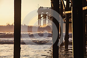 Under the pier at sunset