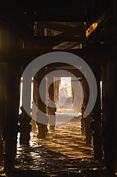 Under the pier at sunset