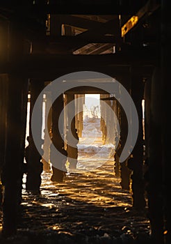 Under the pier at sunset