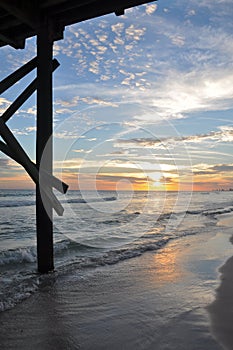 Under pier sunset