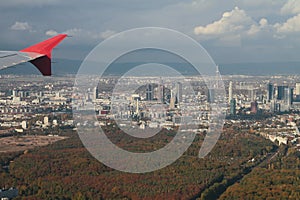 Under plane wing large city and its vicinities, aerial photograph. Frankfurt am Main, Germany