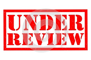 Under review rubber Stamp over a white background
