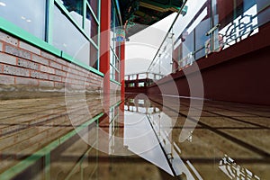 Under the roof of traditional Korean patterns, the balcony is filled with water, so you can see the reflection photo