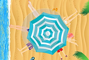 Under an umbrella on the beach