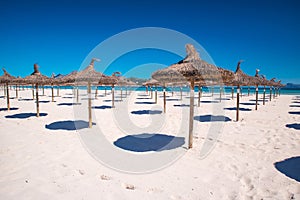 Under umbrellas at arenal beach playa de palma. Mallorca, spain, summer holiday photo