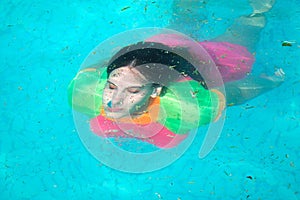 Under water portrait of woman diving