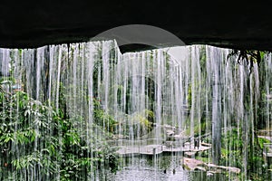 Under the waterfall