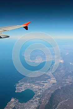 Under wing of plane Black Sea coast of Caucasus, aerial photography. Gelendzhik-Novorossiysk, Russia