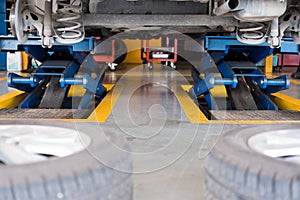 undercarriage of a car in garage. vehicle maintenance in auto re