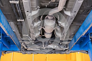 undercarriage of a car in garage. vehicle maintenance in auto re