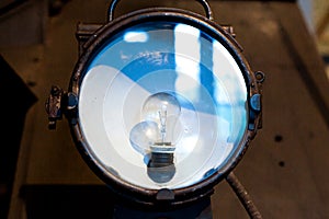Undercarriage floodlight with incandescent lamp of a vintage steam locomotive