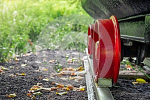 the undercarriage of a traditional mine cart.