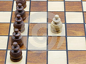 Underdog Concept: One White Pawn Standing Against Black Pawns