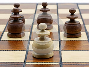 Underdog Concept: One White Pawn Standing Against Four Black Pawns