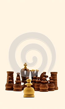 Underdog Concept: White Pawn Standing Against Black Chess Pieces