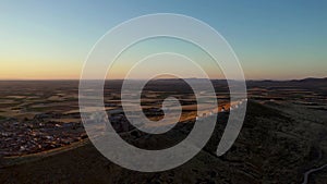 Underexposed video at sunrise of the Castle of Consuegra with the famous windmill from Consuegra