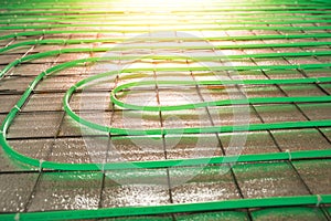 Underfloor heating green pipe installation