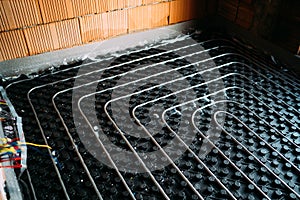 Underfloor heating pipes in house construction
