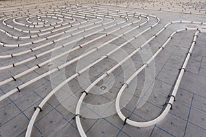 Underfloor heating system installation. Close up on water floor heating system interior of a new indoor swimming pool