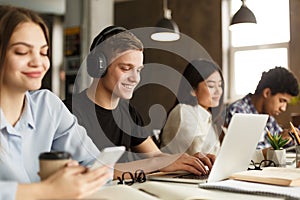 Undergraduate student preparing for final exams on laptop