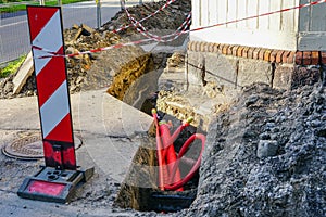 Underground communications and street and sidewalk replacement on city street