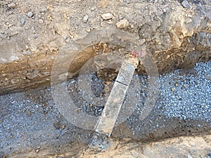 Underground crossing of town and houses utilities under pavement