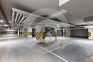 Underground empty parking garage. Modern urban space