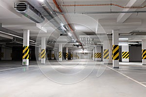 Underground empty parking garage. Modern urban space