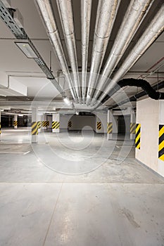 Underground empty parking garage. Modern urban space