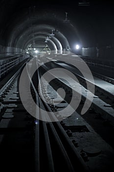 Underground facility with a big tunnel leading deep down. Metro - subway construction site