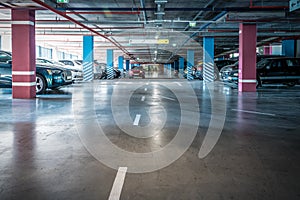 Underground garage or modern car parking with lots of vehicles