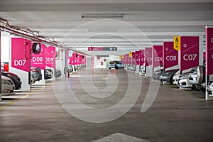 Underground interior garage parking lot with many cars