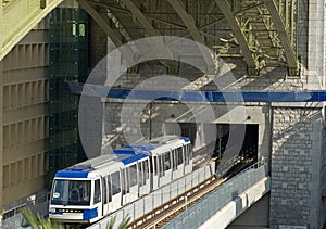 Underground Metro train underneath road bridge