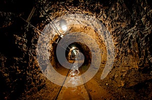 Underground mine passage with rails