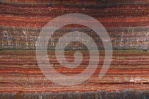 Underground multicolor background fragment with traces of large drilling equipment on wall in potassium and sodium salts