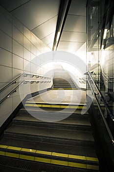 Underground passage with stairs going up the light