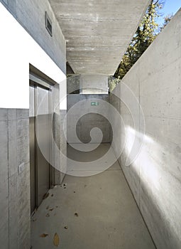 Underground passage but still illuminated by the sun of a concrete building.