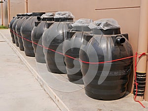 Underground plastic septic tanks for sale being displayed in a row