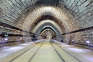 Underground railroad with moving train, transporation