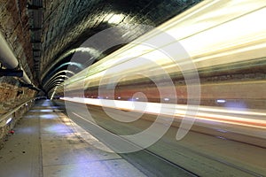 Underground railroad with moving train, transporation