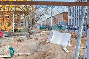 Underground Rennovation Works in City with Fence Wire At Foregound photo