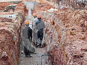 Underground sewerage pipe installed by construction workers at the construction site.