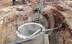 Underground sewerage pipe installed by construction workers at the construction site.